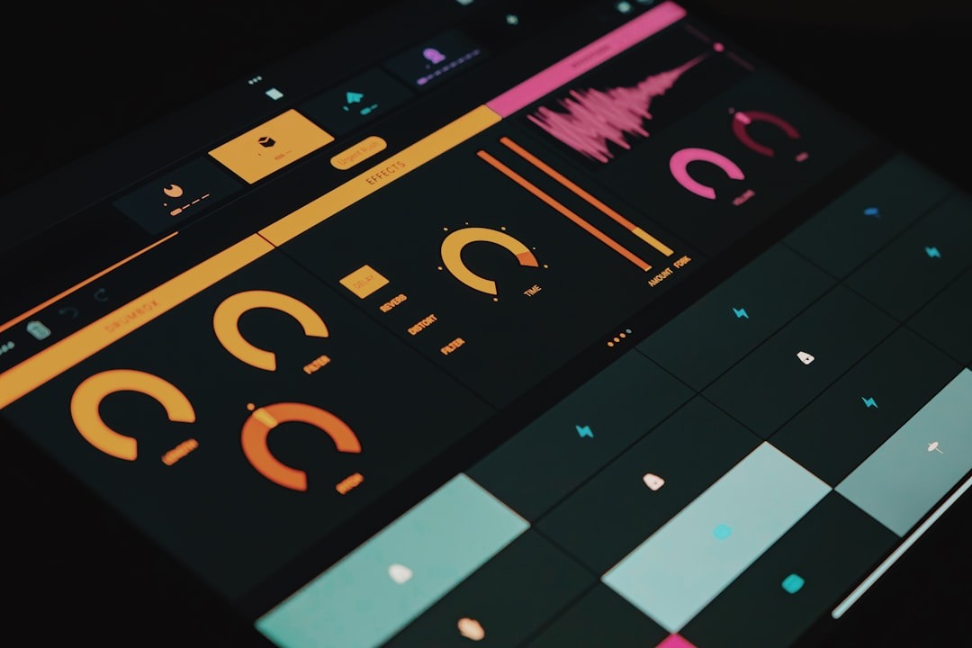 Tablet screen displaying a digital music production interface with colorful graphics.